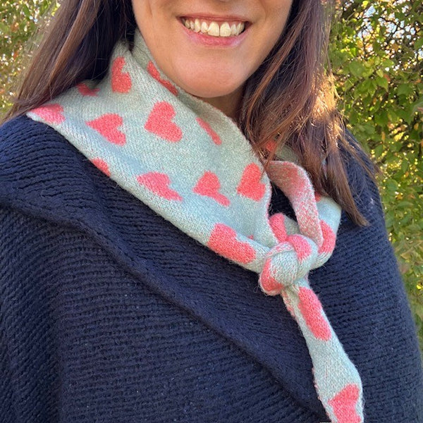 The Pixie Scarf Duck Egg Blue is a super cute heart patterned on-trend triangle accessory