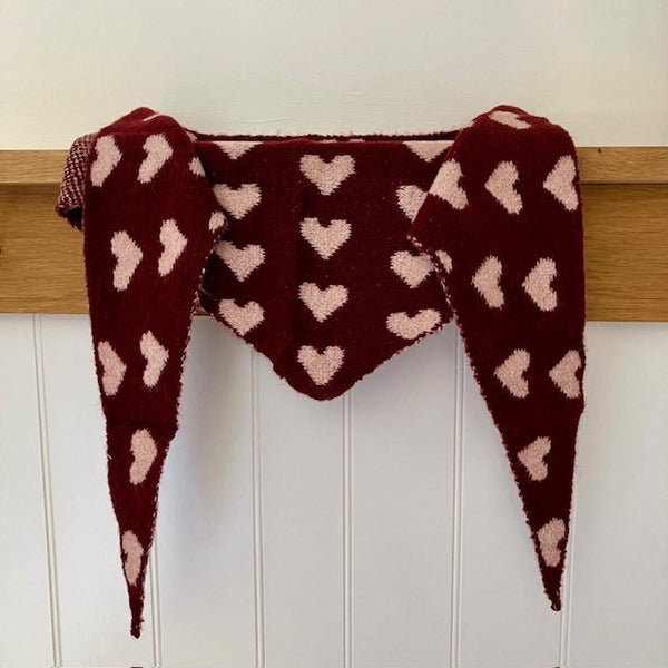 The Pixie Scarf Burgundy is in the on-trend triangle shape