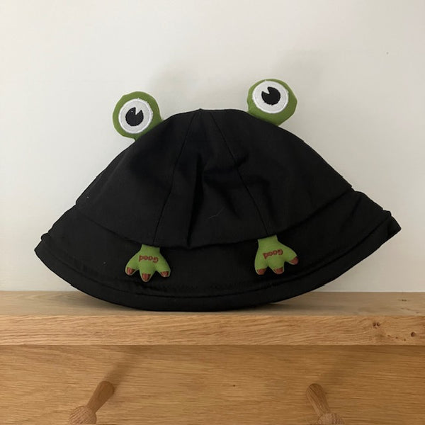 The Polly Frog Bucket Hat Black is a super fun and cute hat for kids and adults alike