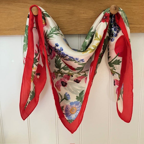 The Poppy Scarf is a small square with the most beautiful array of cottage garden flowers. 