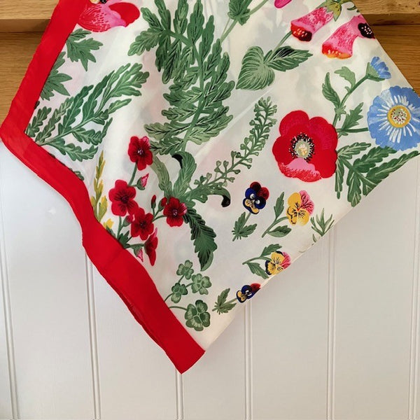 The Poppy Scarf is made out of polyester and has a silky feel