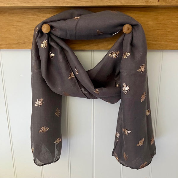 The Queenie Scarf Charcoal features a gorgeous rose gold bee print. A stunning lightweight scarf that makes a great gift for any bee fans.