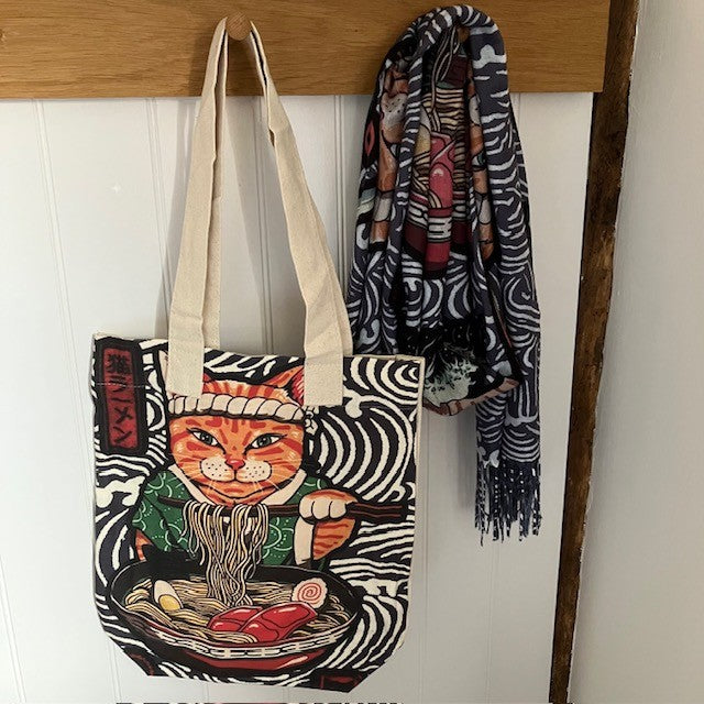 The Ramen Cat Tote Bag is a fabulous unique design with a wave patterned background and Ramen eating Ninja Cat!