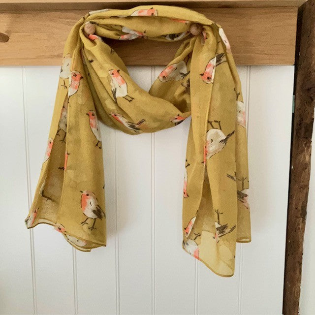 The Robin Scarf Mustard is a super cosy accessory, ideal for Christmas or all year round for any bird enthusiasts