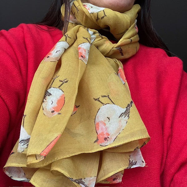 The Robin Scarf Mustard is a super cosy accessory, ideal for Christmas or all year round for any bird enthusiasts