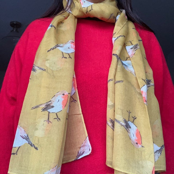 The Robin Scarf Mustard is a super cosy accessory, ideal for Christmas or all year round for any bird enthusiasts