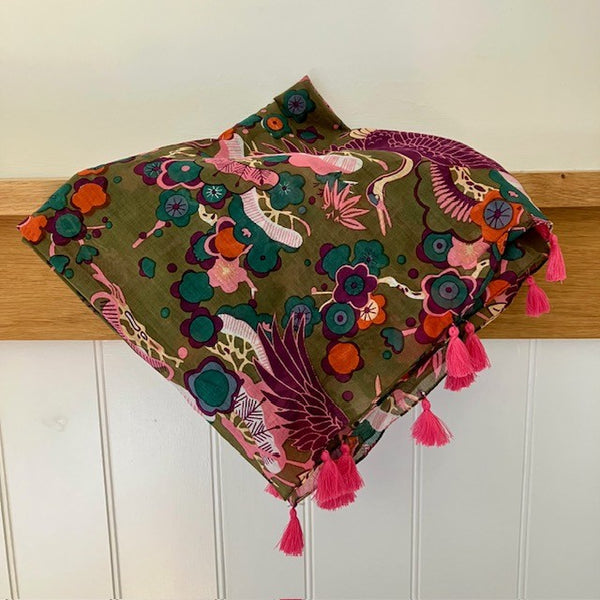 The Sakura Scarf Khaki is rectangular in shape with gorgeous pink tassel detail at each end
