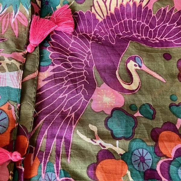 The Sakura Scarf Khaki has a beautiful crane design and abstract floral pattern
