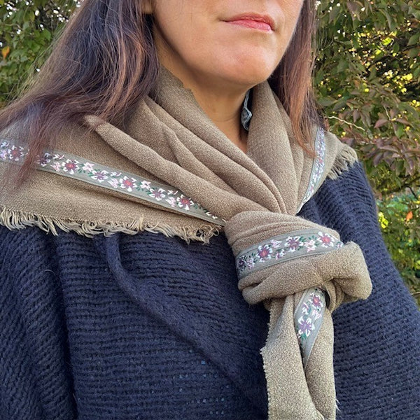 The Samantha Scarf Khaki has rustic frayed edges on the sides