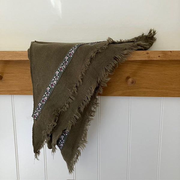 The Samantha Scarf Khaki is a triangle shaped scarf