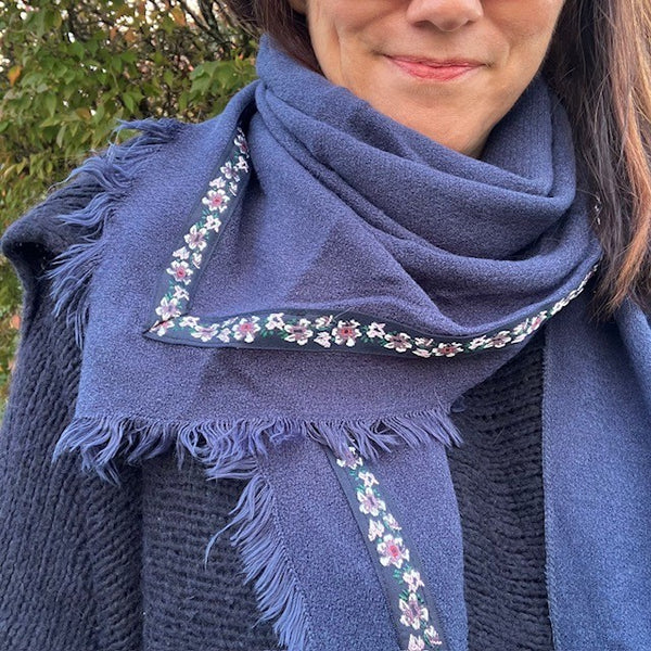 The Samantha Scarf Navy can be worn as a snood around the neck or cape like over the shoulders
