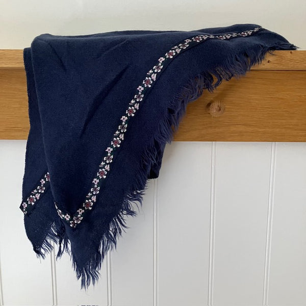 The Samantha Scarf Navy is a triangle shaped scarf