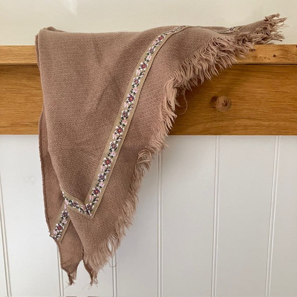 The Samantha Scarf Nude is a triangle shaped scarf