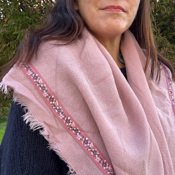 The Samantha Scarf Pink can be worn loose around the shoulders or snug around your neck as a snood for more warmth