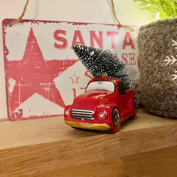 In the background you can see our retro red and white 'Santa Please Stop Here' sign made of tin