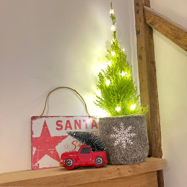 Our retro red and white 'Santa Please Stop Here' sign with other Christmas decorations