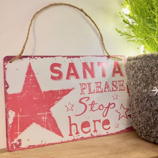 Shabby chic retro red and white 'Santa Please Stop Here' sign made of tin, with a star design