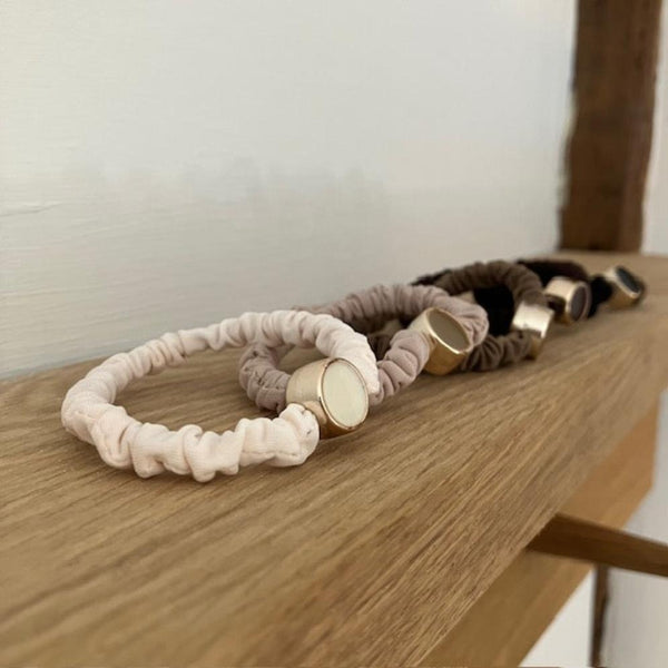 Scrunchie Hair Tie Bracelets Neutral Pack is an ideal cosy accessory to keep on your wrist for when you need to pop your hair up