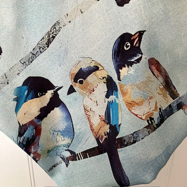 The Seatherny Scarf has a pale blue background and gorgeous British Bird design