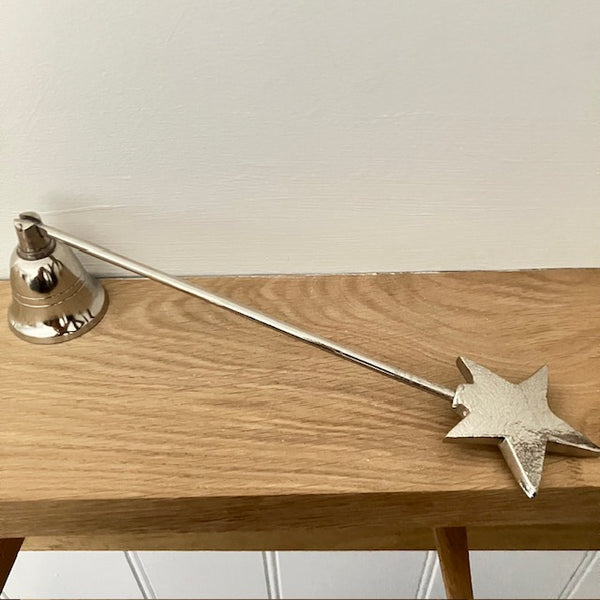 The Star Candle Snuffer extinguishes a candles flame safely