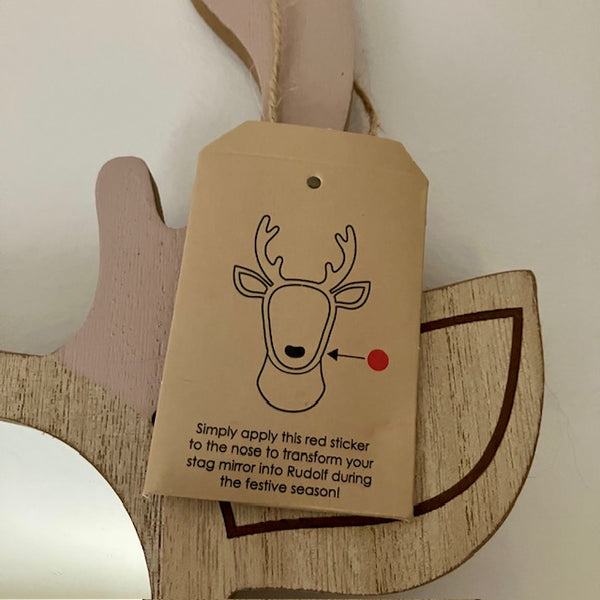 The Stag to Reindeer Wooden Wall Mirror comes with a little pouch containing a sticky red nose