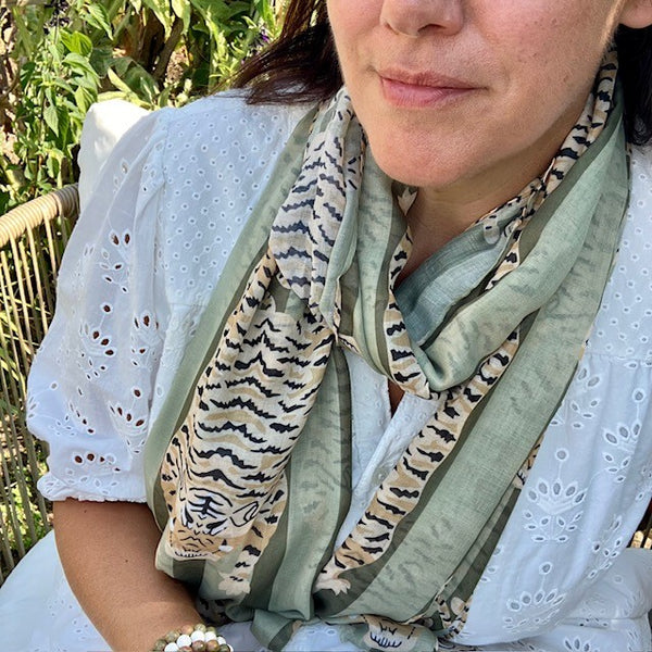 The Tigerlily Scarf Green is a large rectangular scarf that can be worn multiple ways