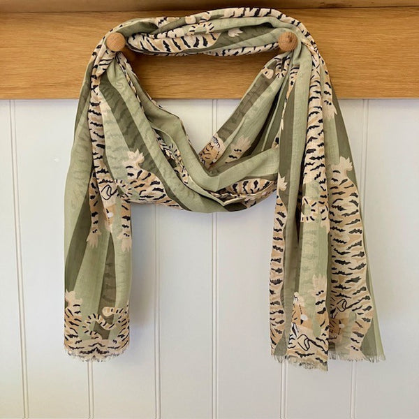 The Tigerlily Scarf Green combines fabulous on-trend stripes with a much loved Tiger. 