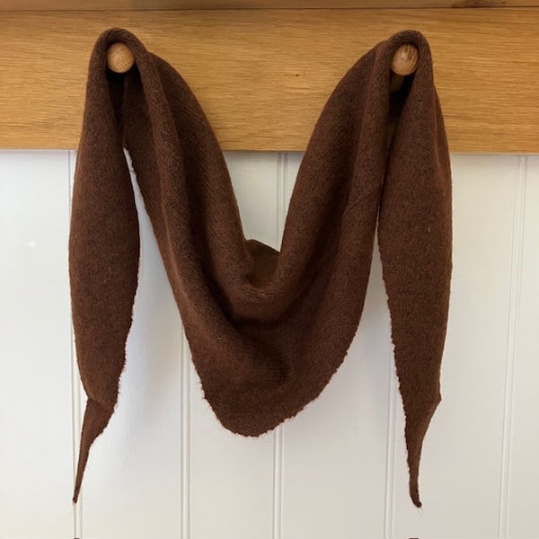 The Tilly Scarf Brown in this much sought after triangle shape and small plain knit, is the perfect cosy accessory to elevate your outfit this season