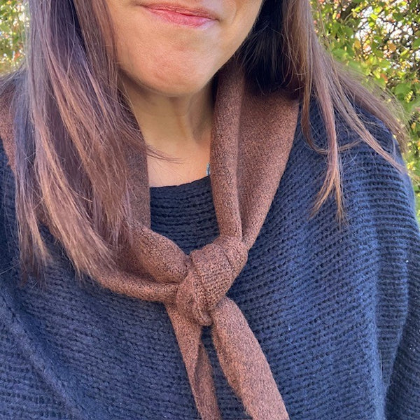 The Tilly Scarf Brown is in the on-trend triangle shape
