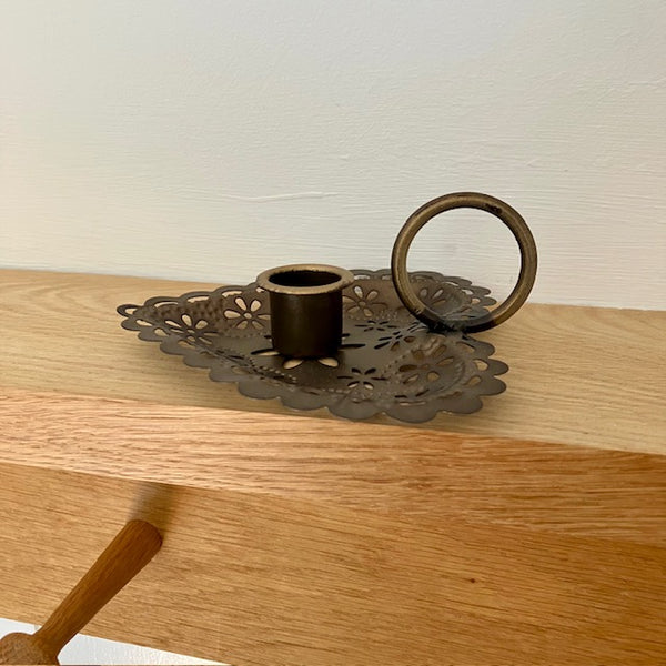 A Wee Willie Winkie candle holder (also called a chamberstick)