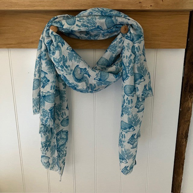 The Cottage Wildlife Scarf Teal is a cosy British cottage garden print including wildlife 