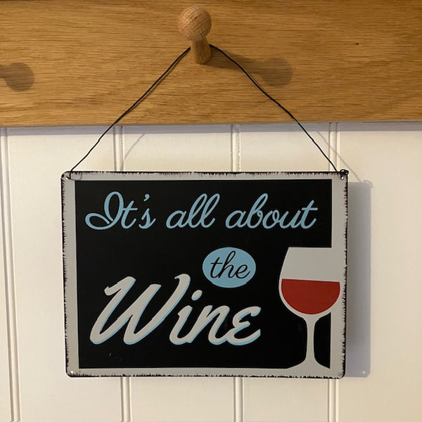 The 'It's All About the Wine' Sign is a fun gift for wine connoisseurs