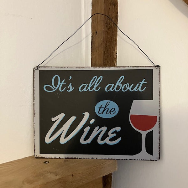 The 'It's All About the Wine' Sign is a fun gift for wine connoisseurs