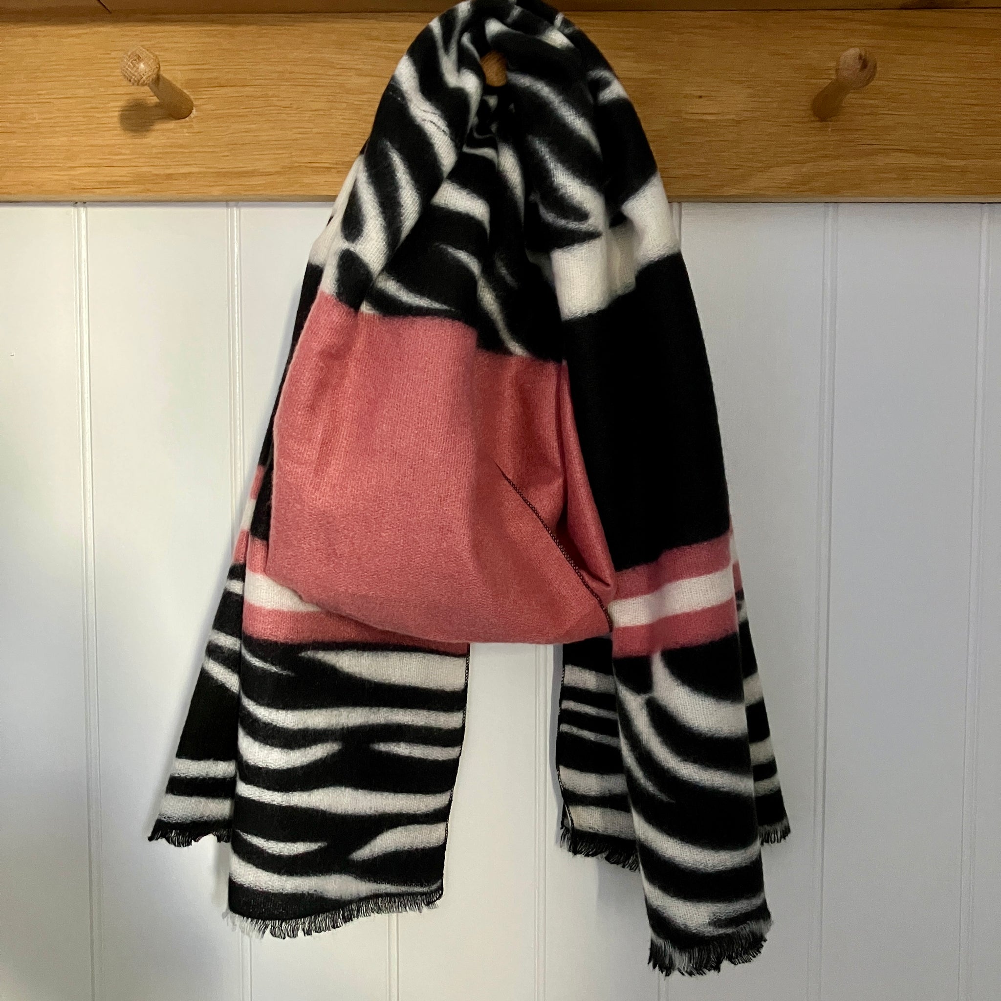 The Zara Scarf Black, White and Pink in this on-trend zebra print pattern is a fabulous statement scarf that is super soft and cosy