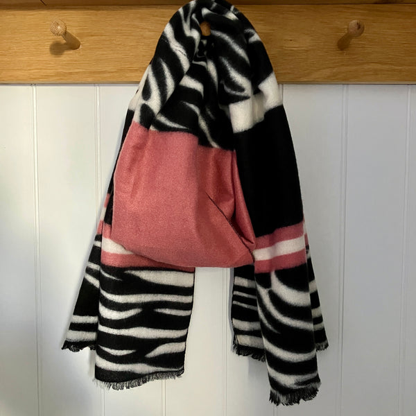 The Zara Scarf Black, White and Pink in this on-trend zebra print pattern is a fabulous statement scarf that is super soft and cosy