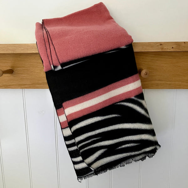 Zara Scarf in this on-trend zebra print pattern with a fabulous warm pink band of colour running through it