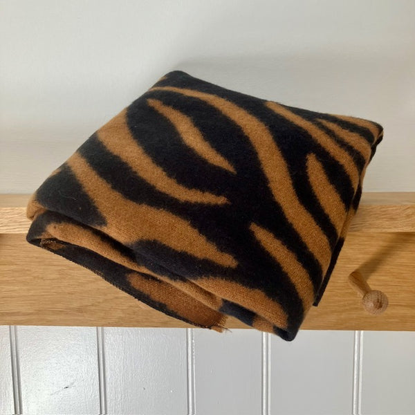 Gorgeous animal print scarf in black and tan zebra print folded