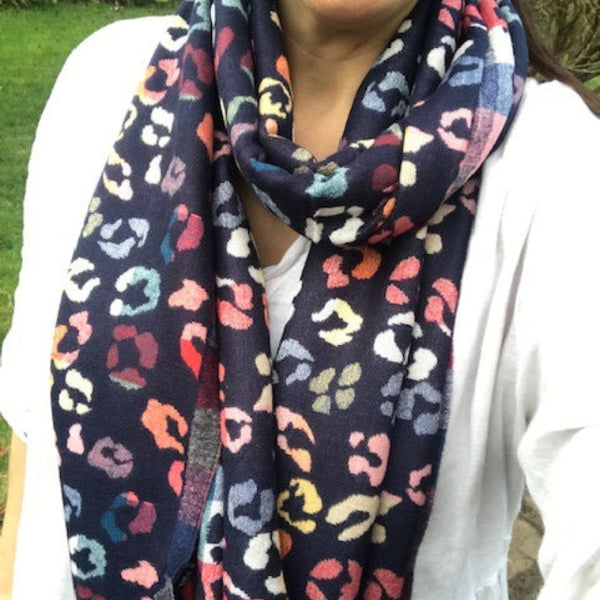 The Cece Navy scarf has a fabulous on trend leopard print pattern in a rainbow of colours, making this a stand out cosy scarf