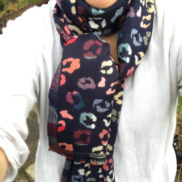 The Cece Navy scarf has a fabulous on trend leopard print pattern in a rainbow of colours, making this a stand out cosy scarf