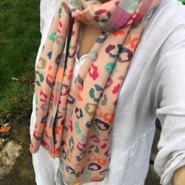 The Cece Pink scarf has a fabulous on trend leopard print pattern in a rainbow of colours, making this a stand out cosy scarf