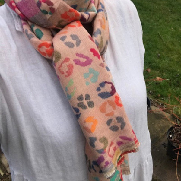 The Cece Pink scarf has a fabulous on trend leopard print pattern in a rainbow of colours, making this a stand out cosy scarf