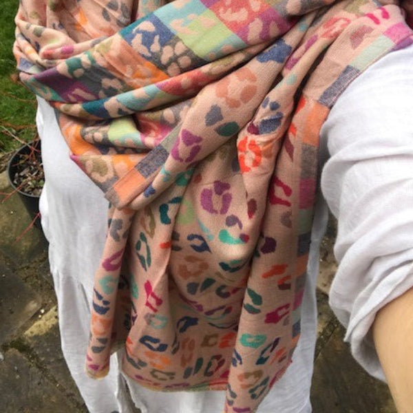 The Cece Pink scarf has a fabulous on trend leopard print pattern in a rainbow of colours, making this a stand out cosy scarf