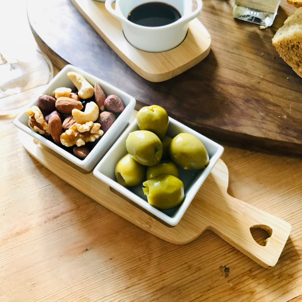 Useful little dipping bowls on a bamboo serving board, perfect for cosy nights in