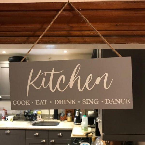 The Kitchen Sign will make the perfect gift for someone that loves to "Cook, Eat, Drink, Sing & Dance" in their kitchen