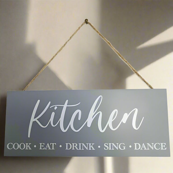 The perfect gift for the person that spends so much time in their Kitchen. Sign says: Kitchen, Cook, Eat, Drink, Sing, Dance