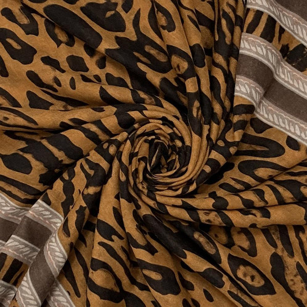 The Mari Leopard Print Brown is a must have animal print scarf that will elevate any outfit