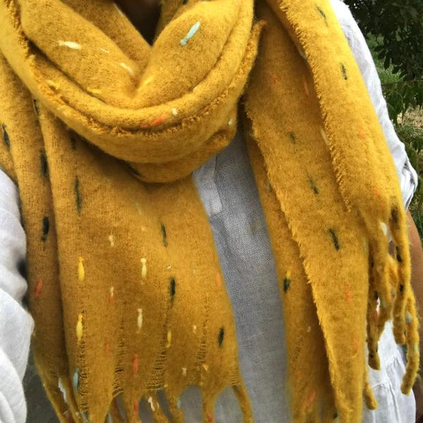 The Theodora Mustard is a super soft large statement scarf that will keep you very cosy and warm