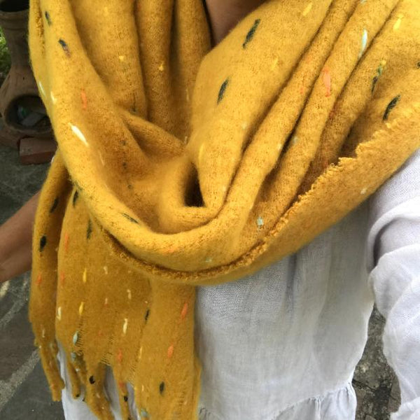 The Theodora Mustard is a super soft large statement scarf that will keep you very cosy and warm