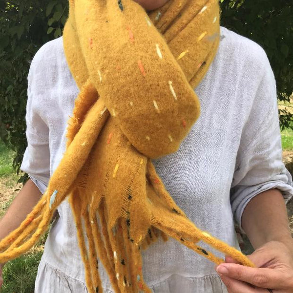 The Theodora Mustard is a super soft large statement scarf that will keep you very cosy and warm