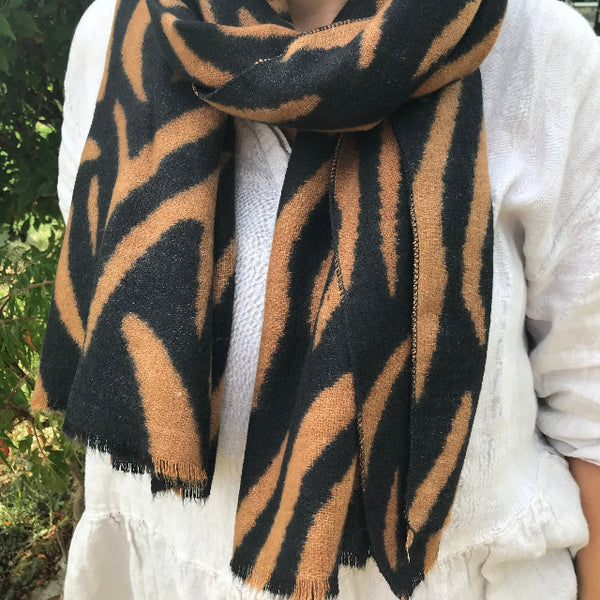 Gorgeous animal print scarf in black and tan zebra print worn long